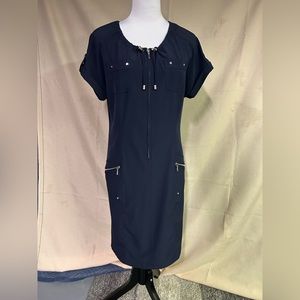 Chico’s “zenergy” navy blue dress with gathered neck and zipper detail.